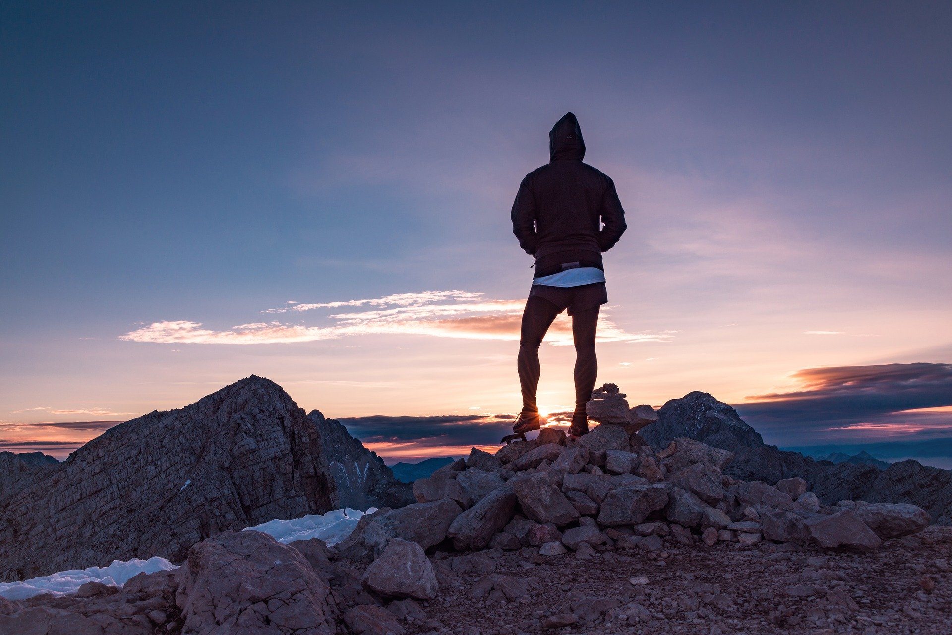 A person at sunrise on a mountian top